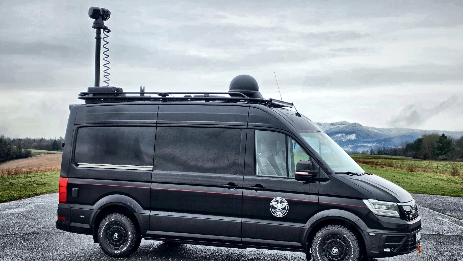 C2 Defender command-and-control vehicle with mast-mounted multisensor head and radome deployed